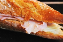An artisan sandwich with deli meats